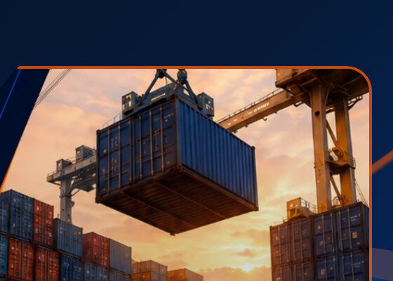 Shipping container being lifted by crane at a port during sunset
